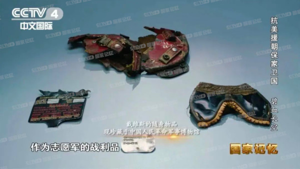 毛主席握着他的手说：“你打得好啊！”